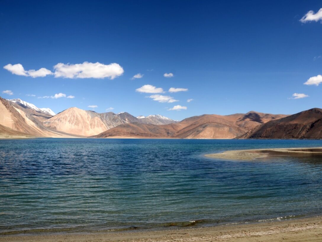 Pangong Lake - a blue lake surrounded by the Himalayan mountains