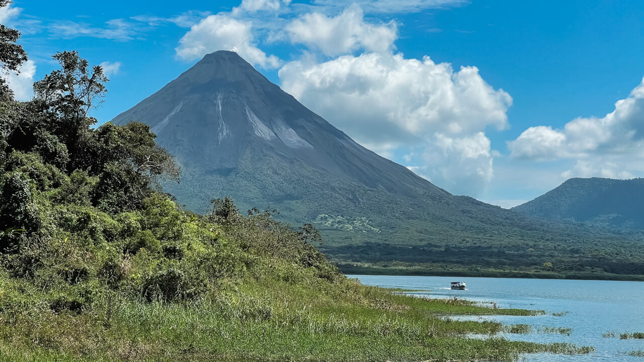 Arenal Volcano and Arenal Lake - sights of which can be enjoyed during a shuttle transfer from La Fortuna to Monteverde and vice-versa.