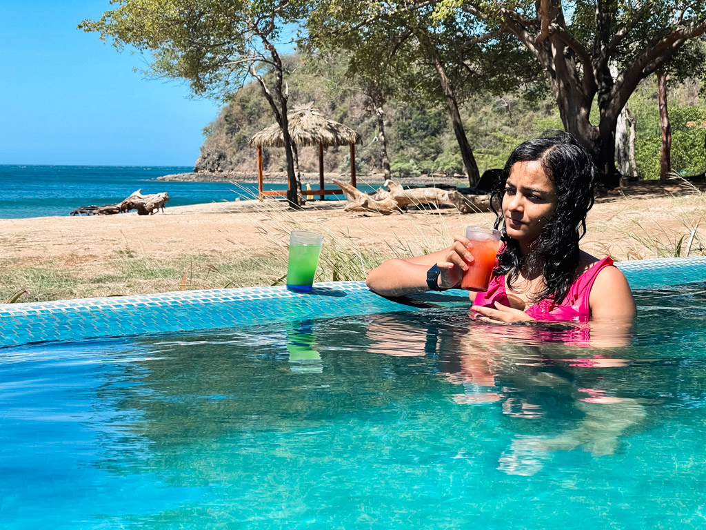 Woman, hanging out at one of the pools at Dreams Las Mareas, a resort near Liberia, Costa Rica.