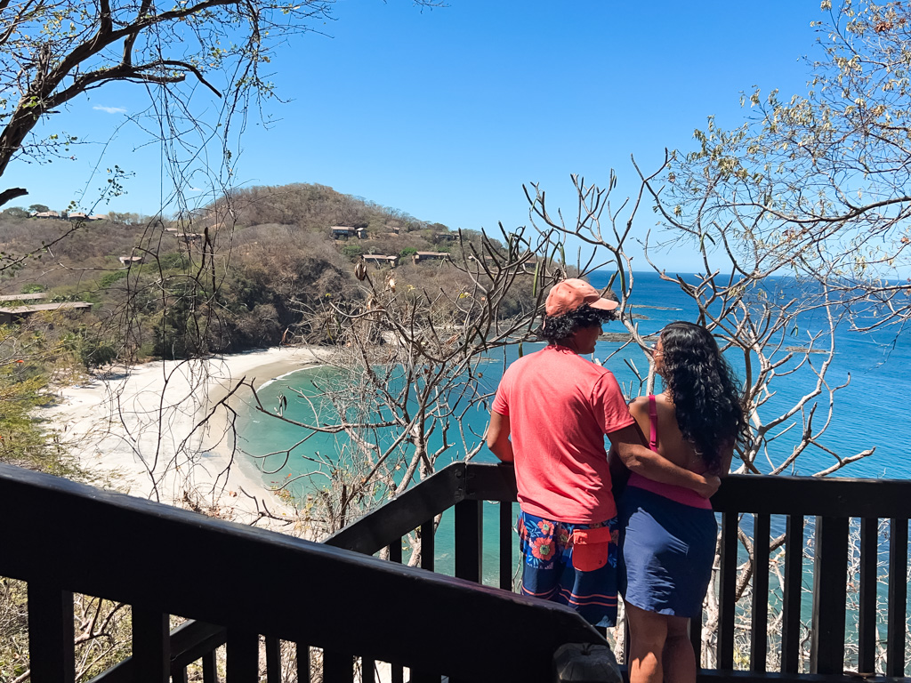 Couple, enjoying the breathtaking ocean views at the Four Seasons Papagayo Resort zone in Costa Rica.