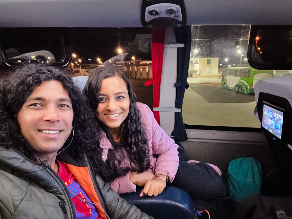 Couple seated inside a bus in Bolivia.