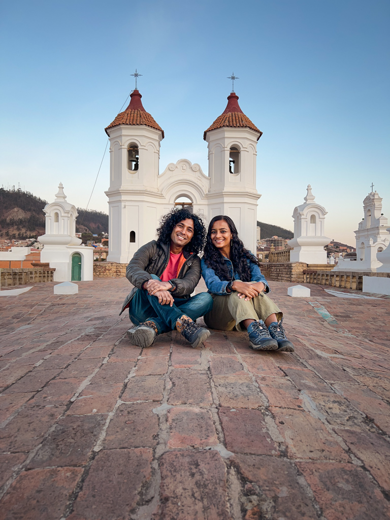 A man and a woman sitting on the roof of San Felipe de Neri Convent in Sucre