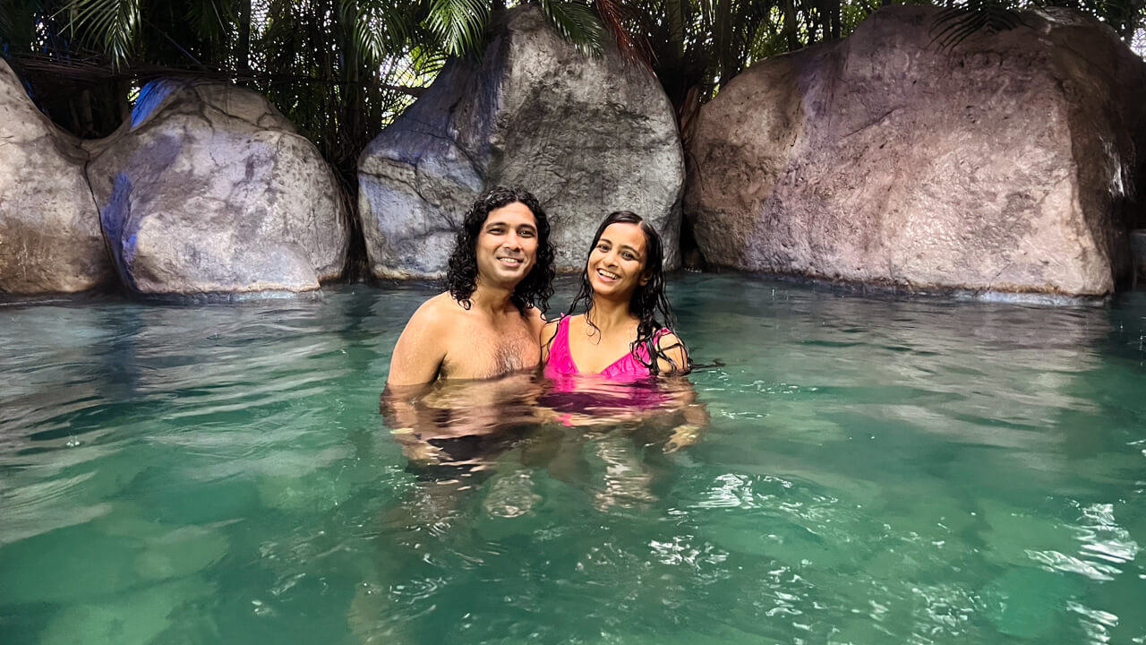 Couple, in one of the thermal pools, at Relax Termalitas Hot Springs in La Fortuna, Costa Rica.