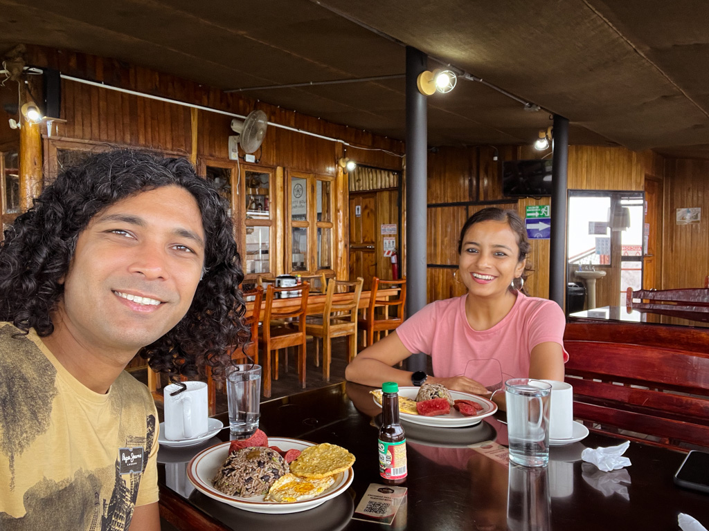 Selfie of a couple eating breakfast with Gallo Pinto at El Mirador restaurant, a good stop during the drive from San Jose to La Fortuna.