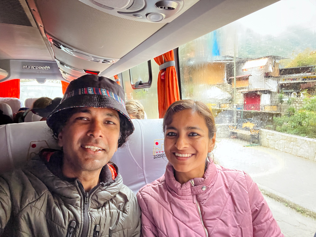 Couple seated inside the Machu Picchu bus, starting from Aguas Calientes.