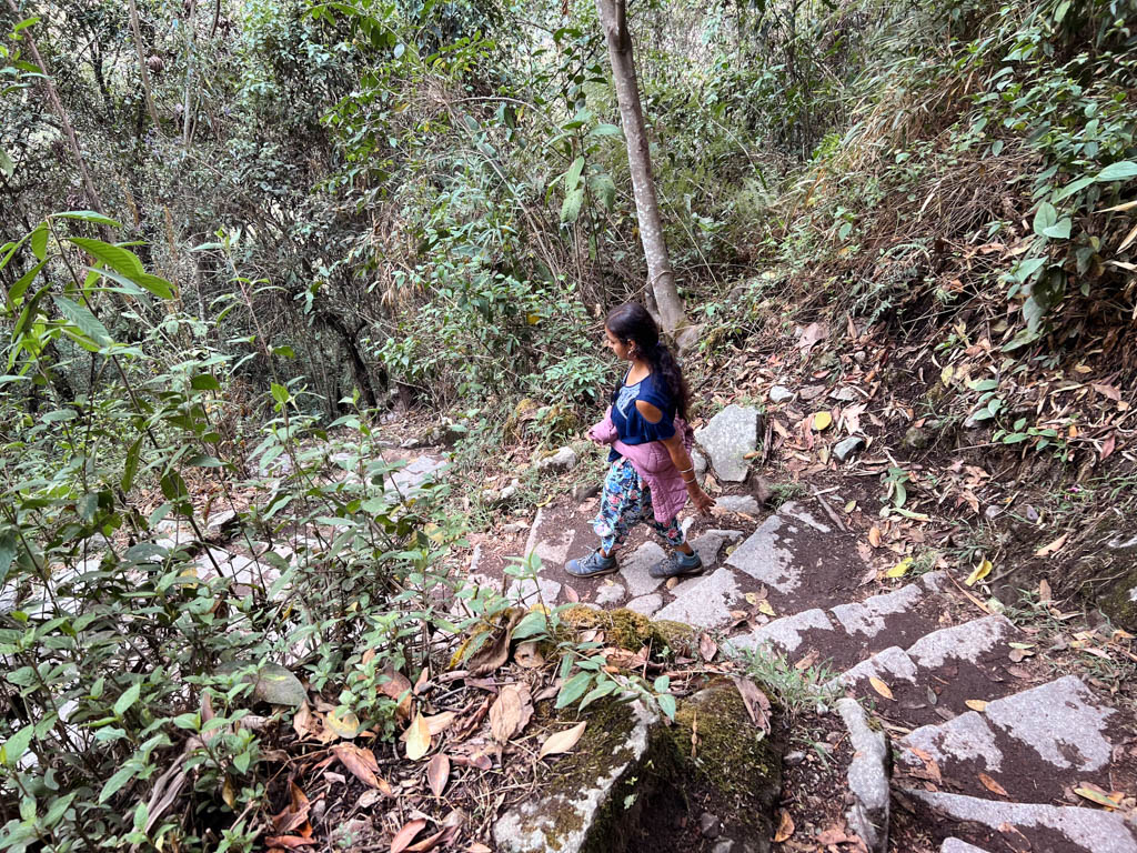 Woman walking down the steps, on the way from Machu Picchu to Aguas Calientes.