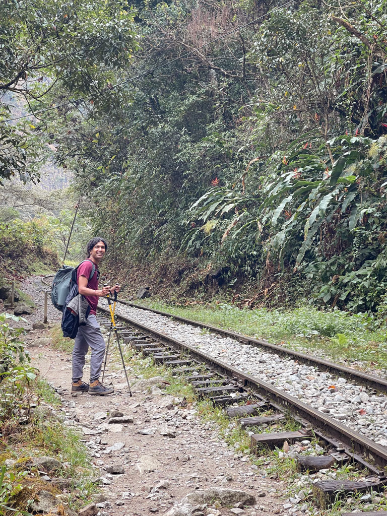 Man, walking next to the train track, on the way from Hidroelectrica to Aguas Calientes.