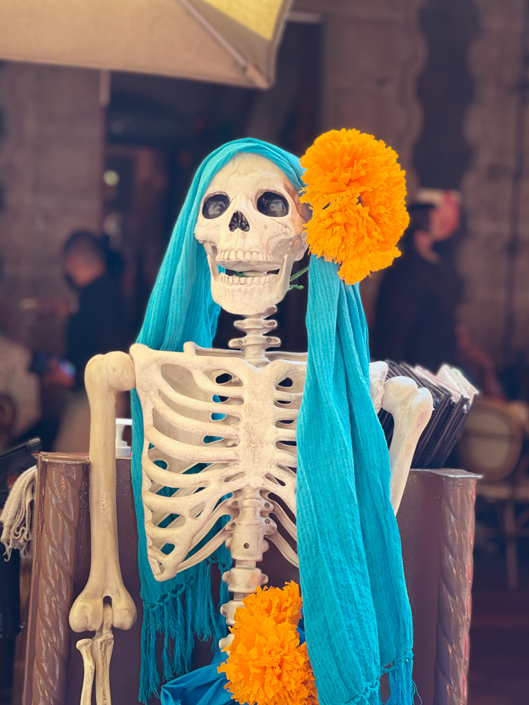 Skeleton and marigold - Day of the Dead special decoration at a restaurant in Mexico City.