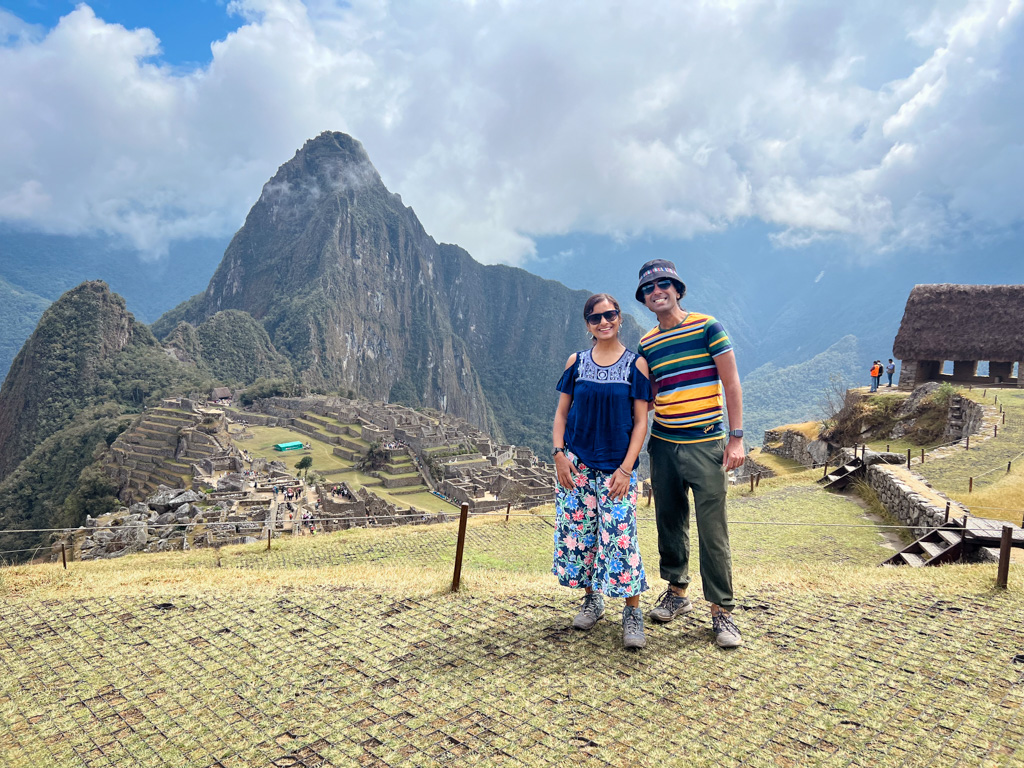 Couple posing for a photo at Machu Picchu.