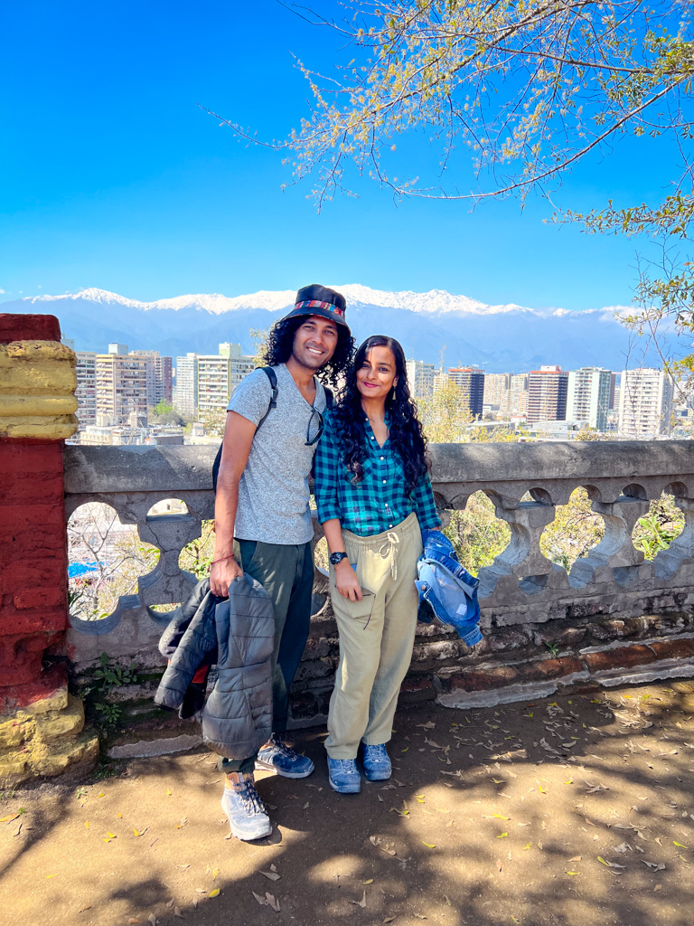 Couple exploring Santiago de Chile, wrapped by the snow-clad Andes mountains.