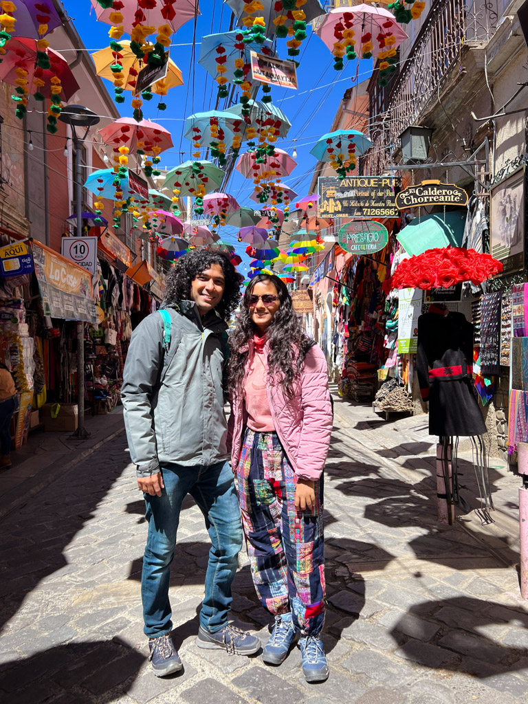 Couple standing on the colorful Calles Linares in La Paz, Bolivia.