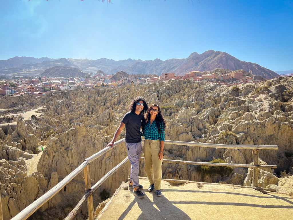 Couple standing at the panoramic viewing platform of Valley of the Moon near La Paz, Bolivia.