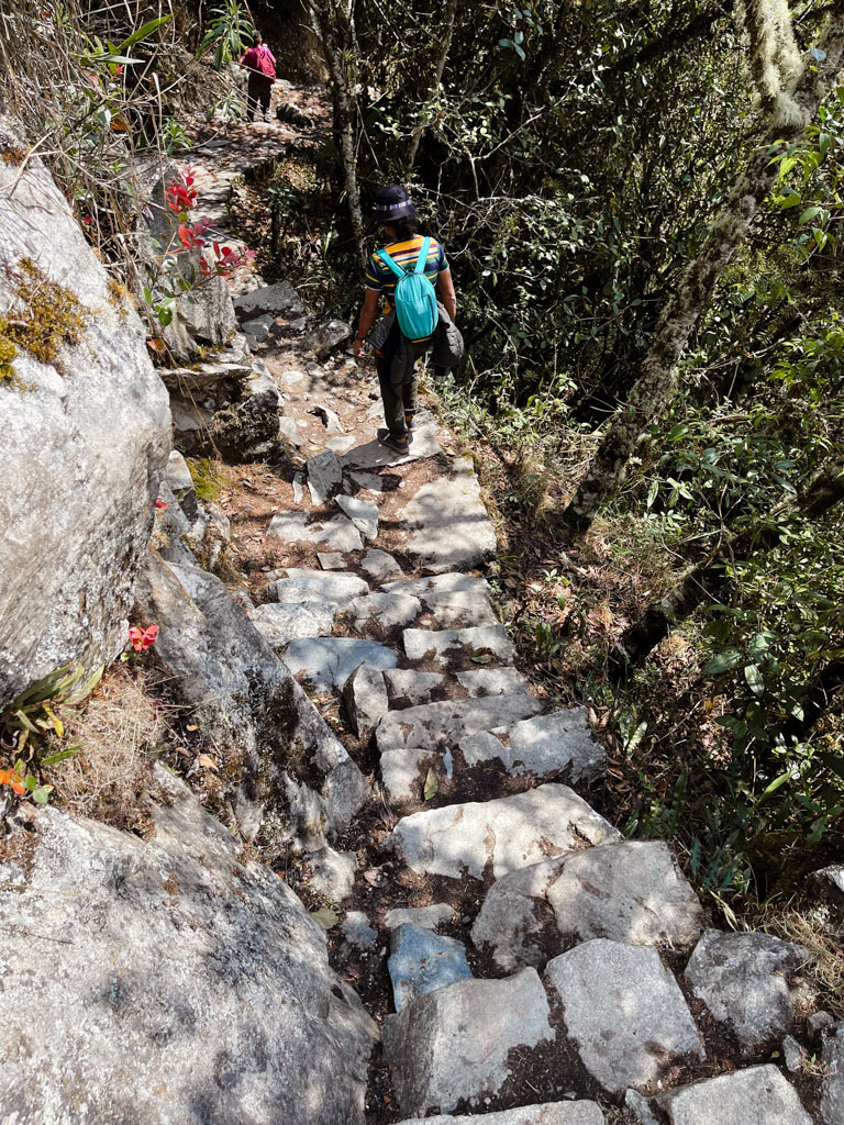 Man walking on the Inti Punku trail at Machu Picchu.