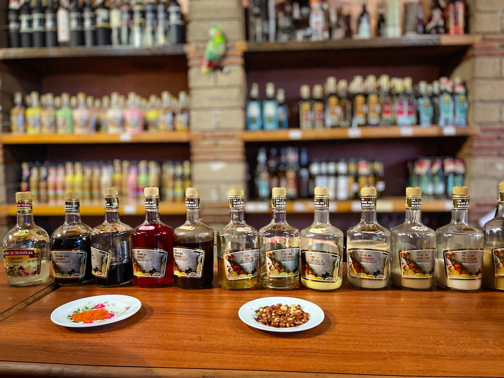 Variety of mezcals to try during mezcal tasting experience in Oaxaca Mexico.